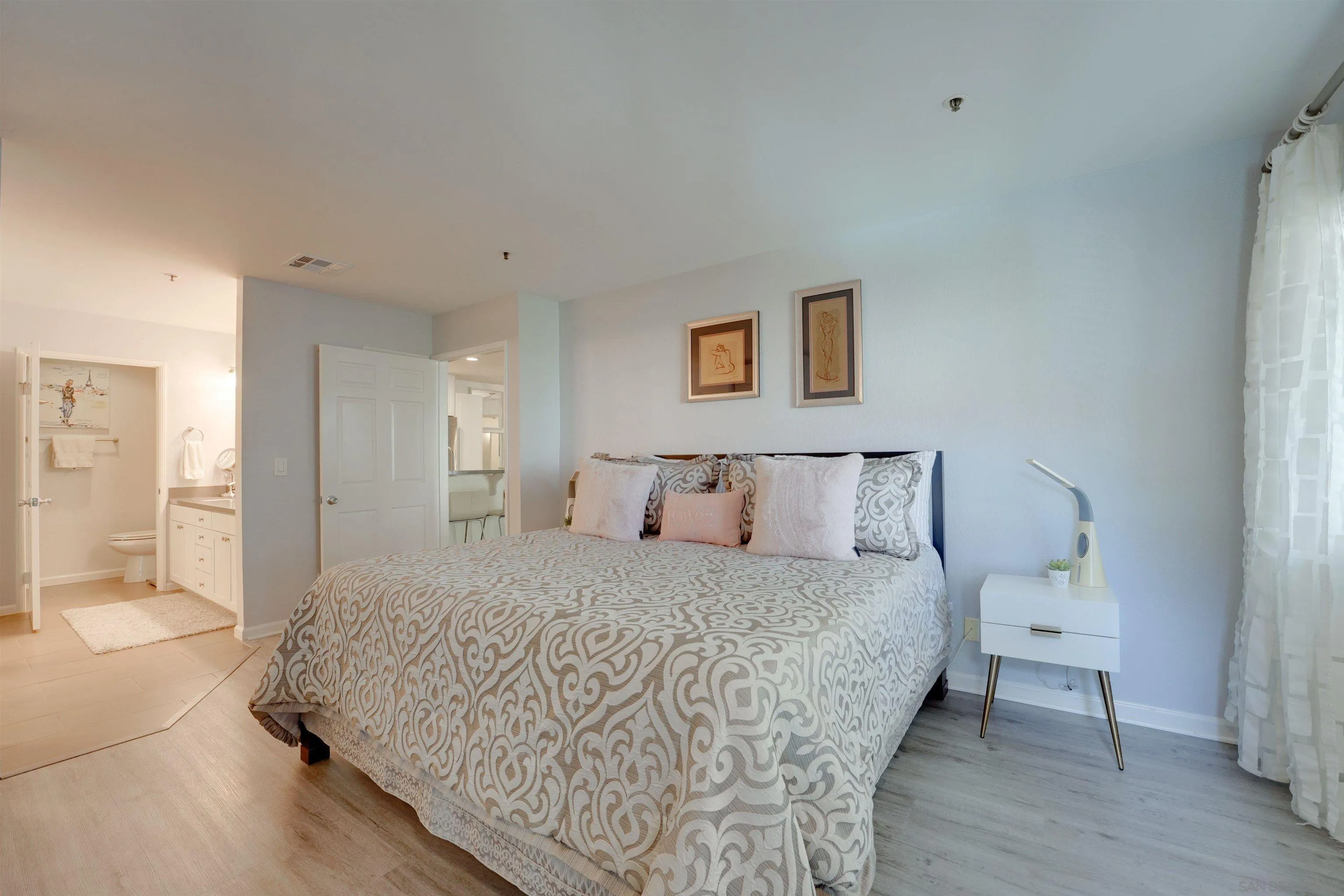 5745 Friars Road, Unit 107 San Diego, CA 92110 - Photo 11 of 25 a bedroom with a bed and a table