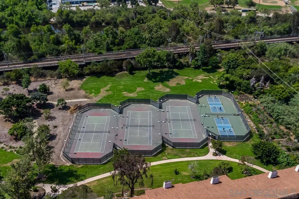 5745 Friars Road, Unit 107 San Diego, CA 92110 - Photo 24 of 25 an aerial view of a house with a garden and outdoor seating