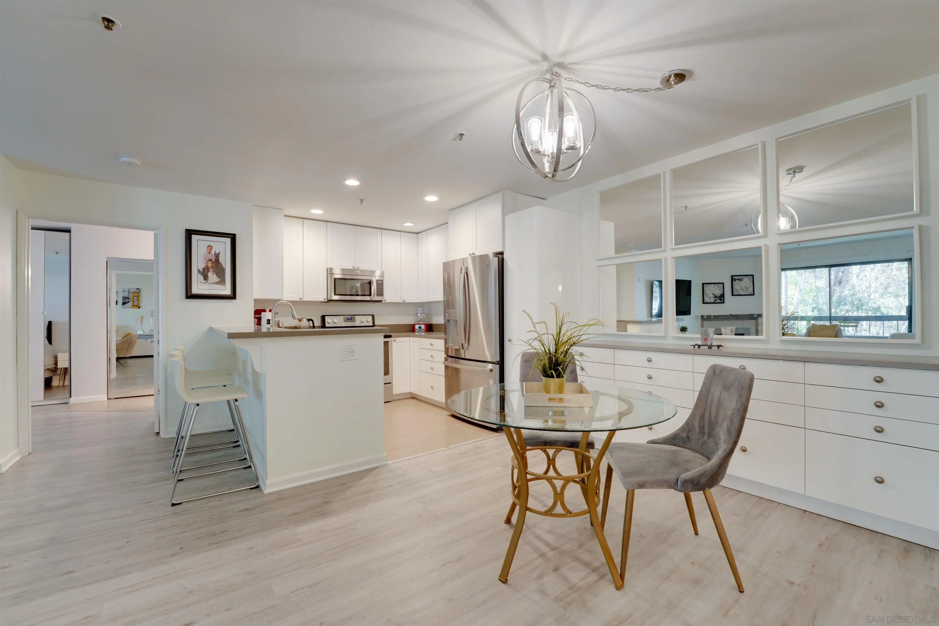 5745 Friars Road, Unit 107 San Diego, CA 92110 - Photo 3 of 25 a view of kitchen and dining area with a sink