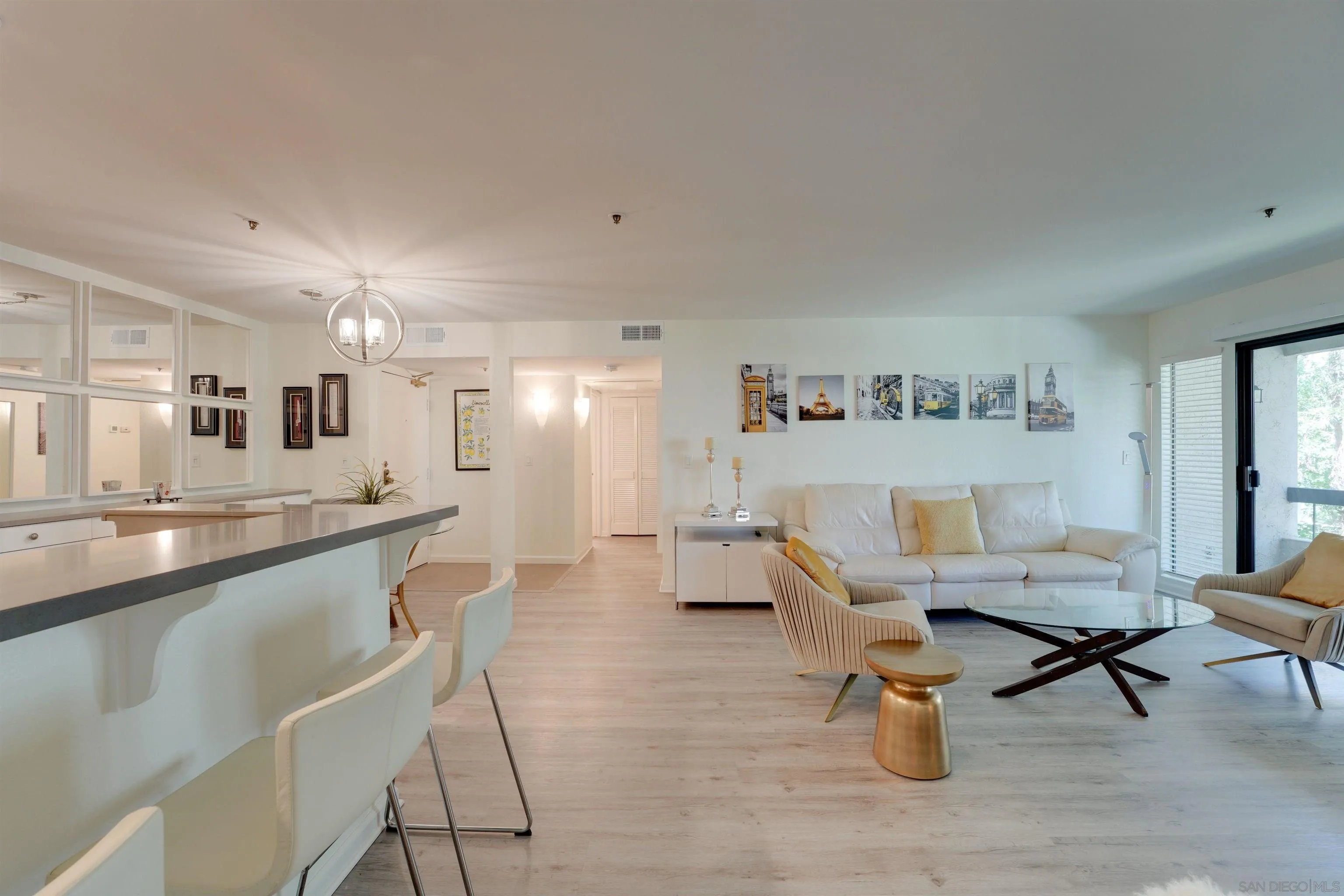 5745 Friars Road, Unit 107 San Diego, CA 92110 - Photo 10 of 25 a living room with furniture and a table