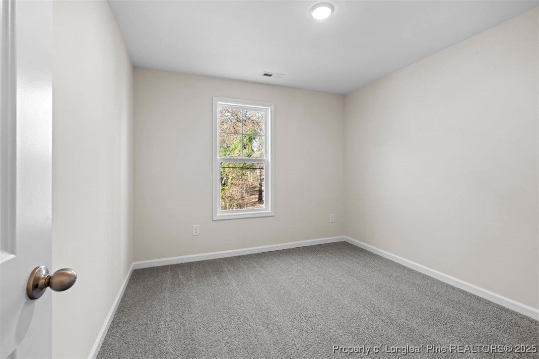 229 Ruritan Drive Fayetteville, NC 28314 - Photo 12 of 16 an empty room with a window