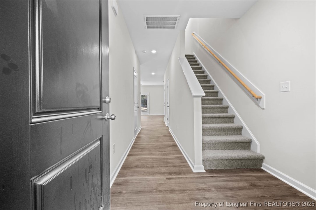 229 Ruritan Drive Fayetteville, NC 28314 - Photo 3 of 16 a view of a hallway with wooden floor and entryway