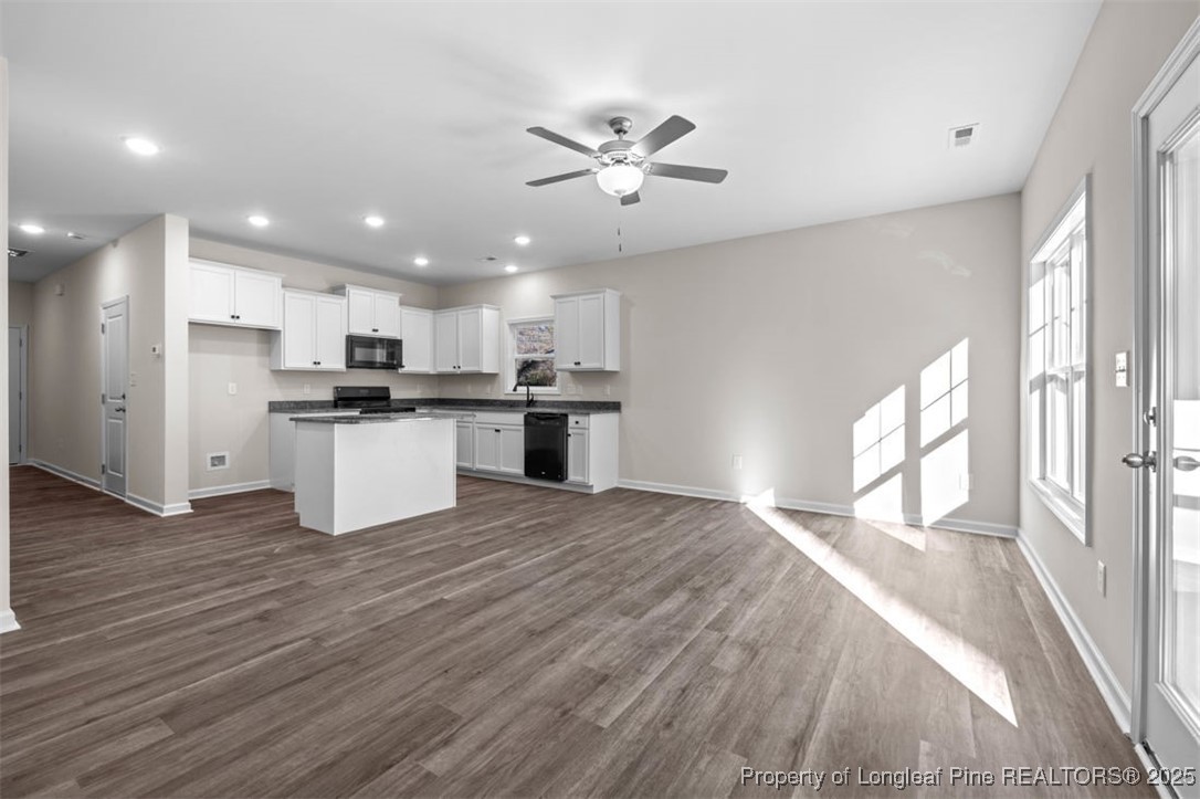 229 Ruritan Drive Fayetteville, NC 28314 - Photo 7 of 16 a view of a kitchen with a sink and wooden floor
