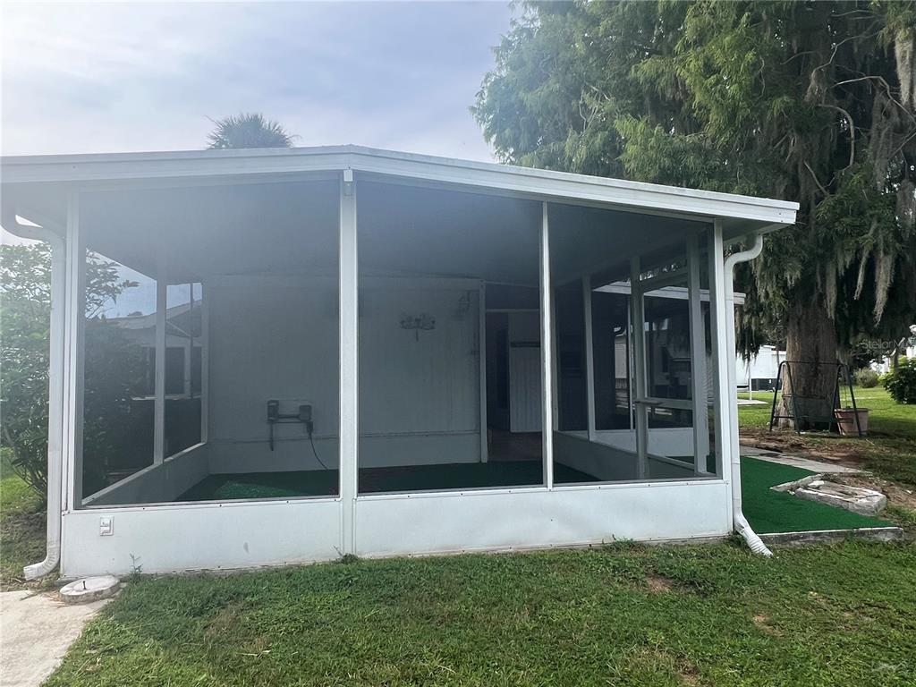 240 Rue De Fontaine Tavares, FL 32778 - Photo 16 of 43 a view of backyard with tub