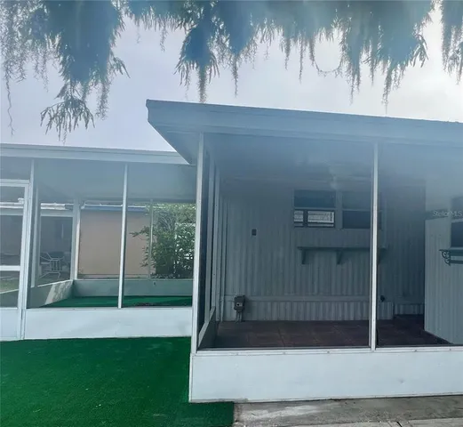 a kitchen with a sink cabinets stainless steel appliances and a window