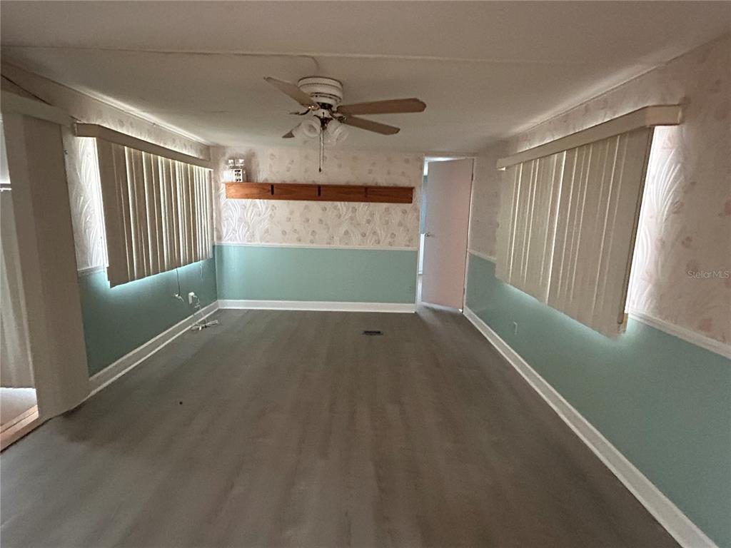 240 Rue De Fontaine Tavares, FL 32778 - Photo 24 of 43 an empty room with a window and ceiling fan