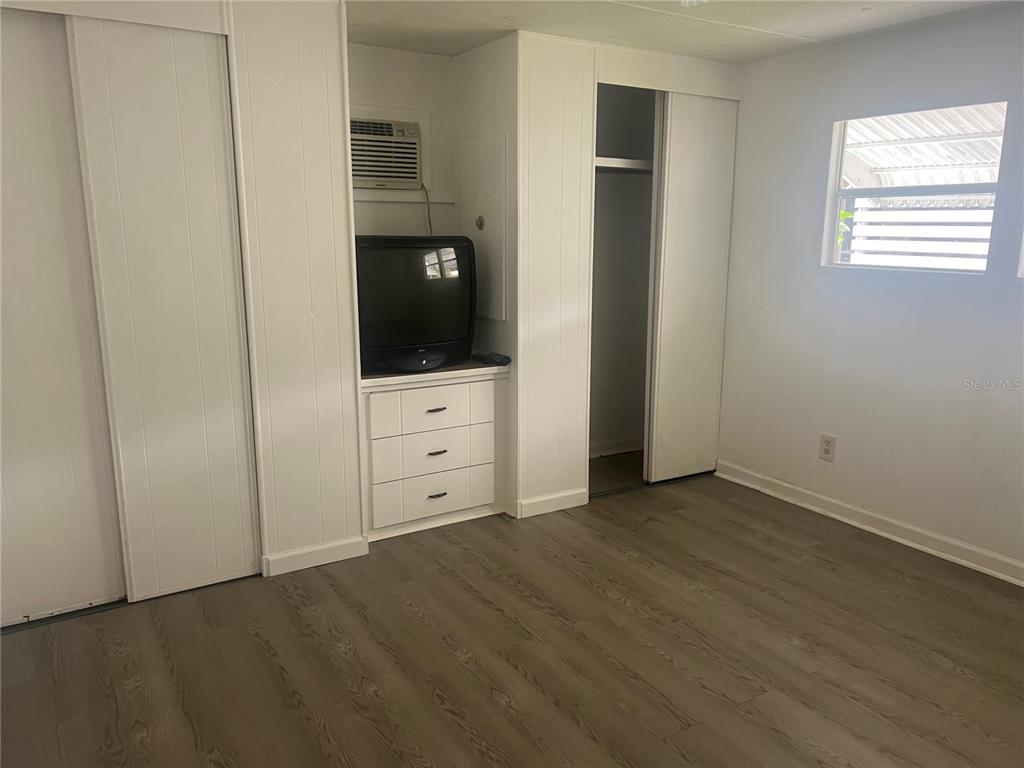 240 Rue De Fontaine Tavares, FL 32778 - Photo 29 of 43 an empty room with windows and cabinet