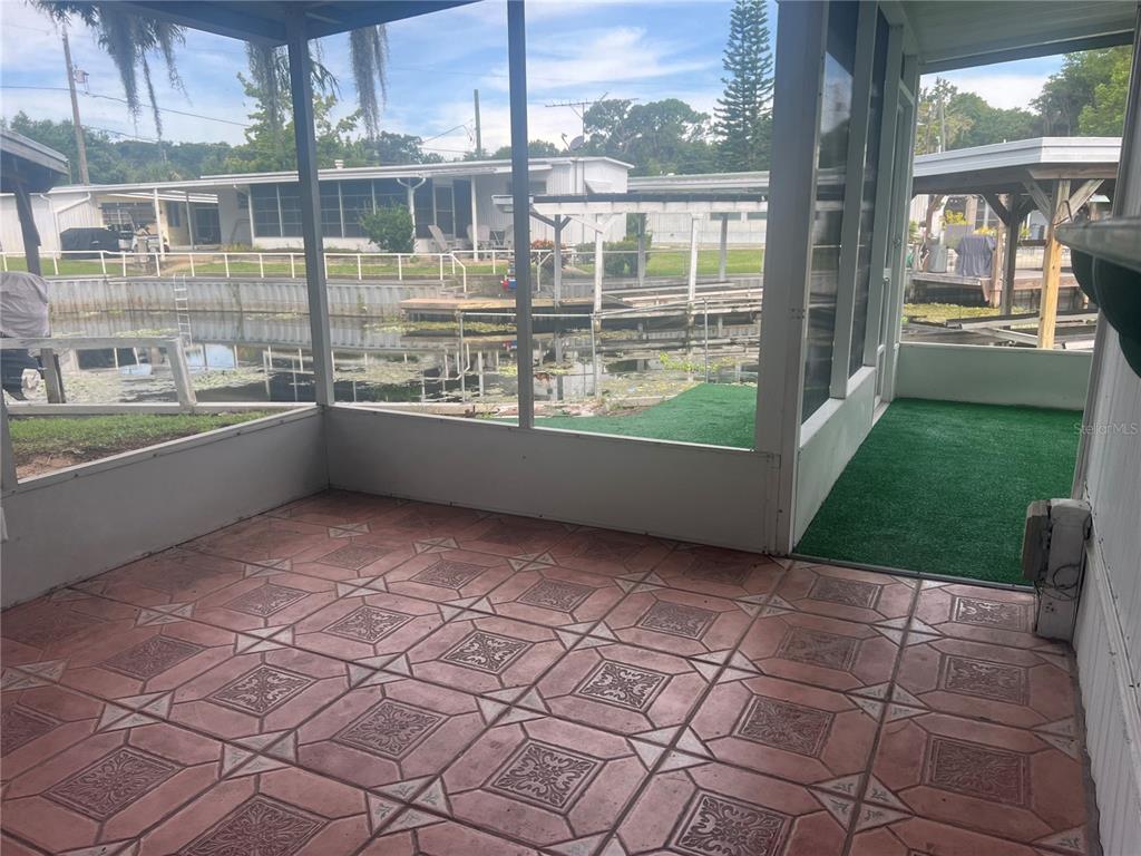 240 Rue De Fontaine Tavares, FL 32778 - Photo 34 of 43 a view of a kitchen with a sink and dishwasher next to a yard