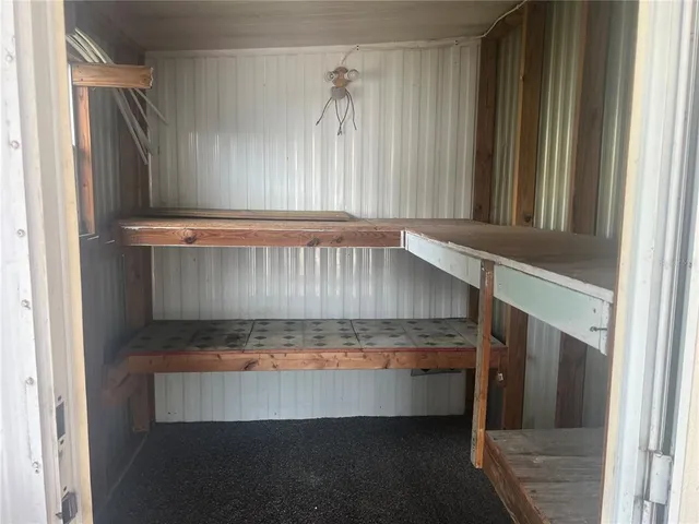 a view of a house with swimming pool and sitting area