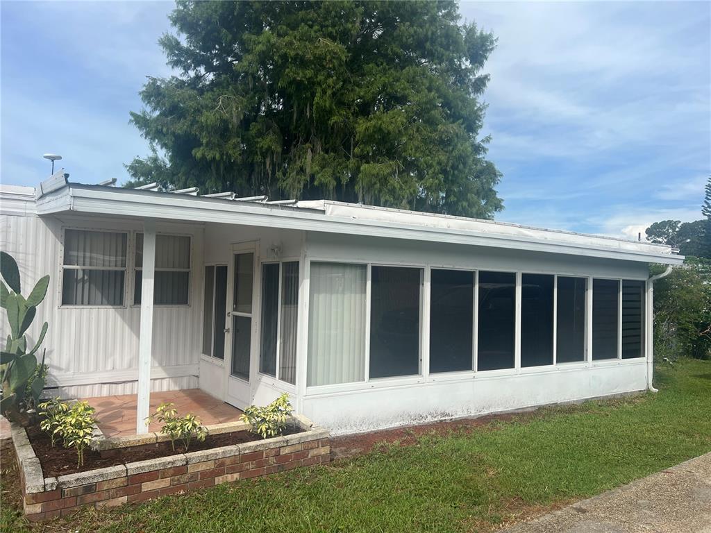 240 Rue De Fontaine Tavares, FL 32778 - Photo 7 of 43 front view of a house with a yard