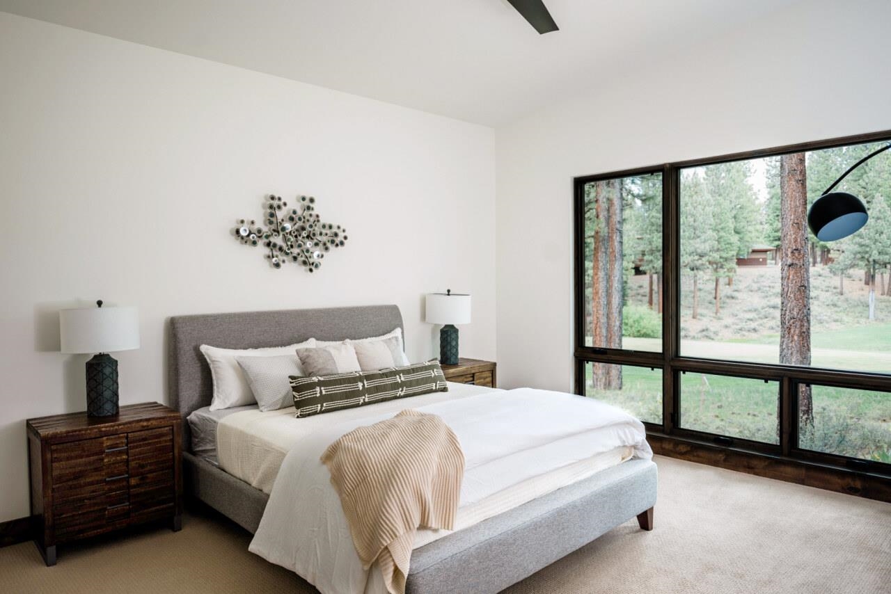 1391 Eagle Feather Portola, CA 96122 - Photo 19 of 28 a bedroom with a large bed and a large window