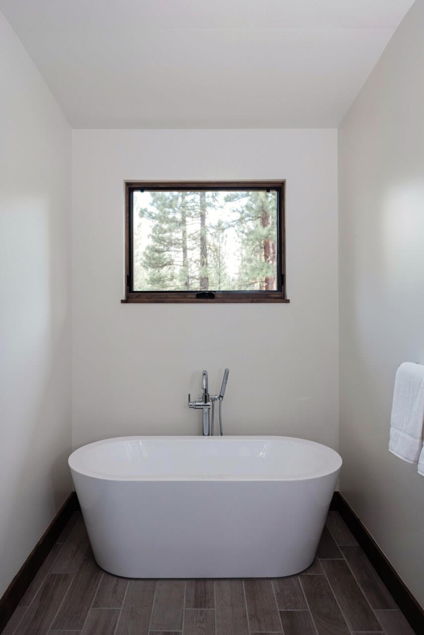 1391 Eagle Feather Portola, CA 96122 - Photo 21 of 28 a white bath tub sitting in a bathroom