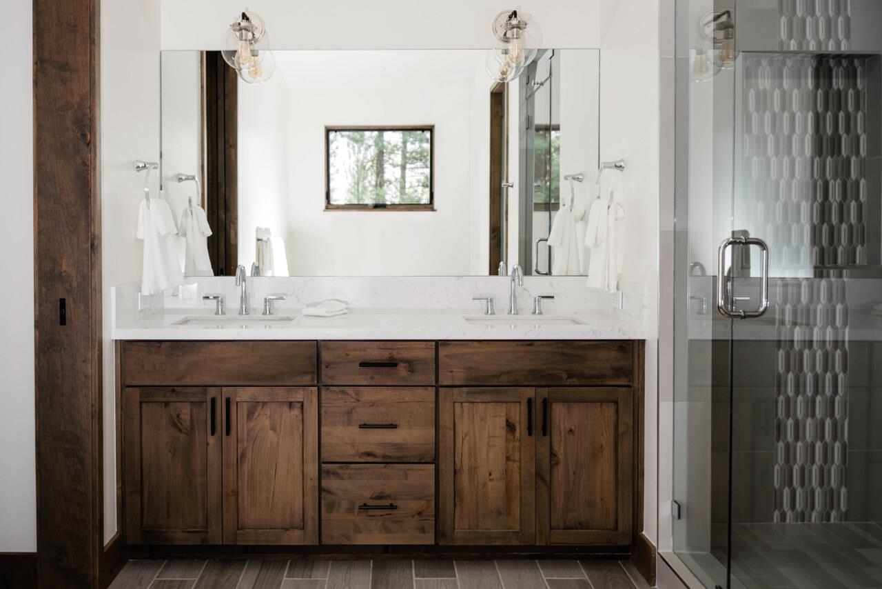 1391 Eagle Feather Portola, CA 96122 - Photo 23 of 28 a bathroom with a double vanity sink and mirror