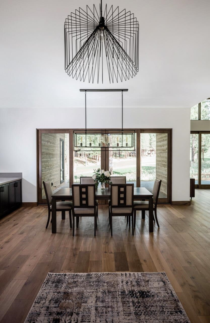 1391 Eagle Feather Portola, CA 96122 - Photo 4 of 28 a dining room with furniture a chandelier and wooden floor