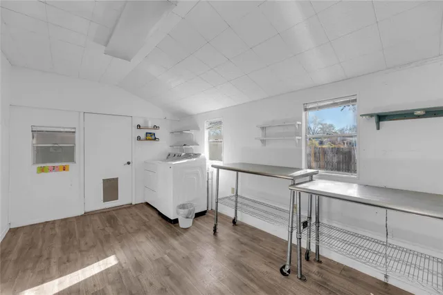 a bedroom with a bed and a ceiling fan