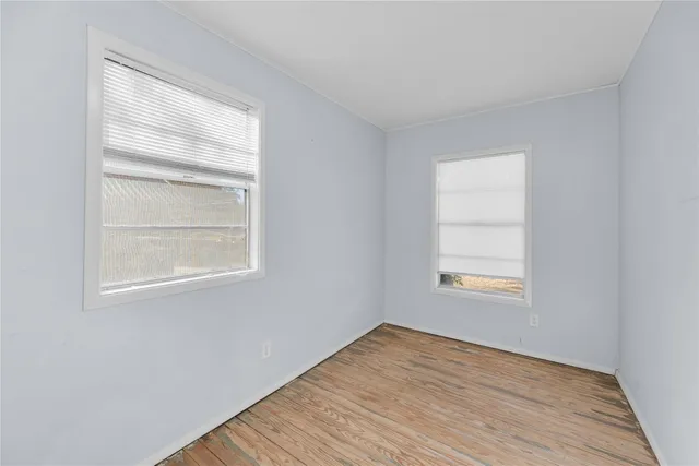 a bathroom with a double vanity sink mirror and shower