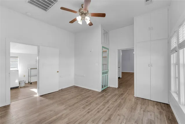 a view of backyard with wooden fence