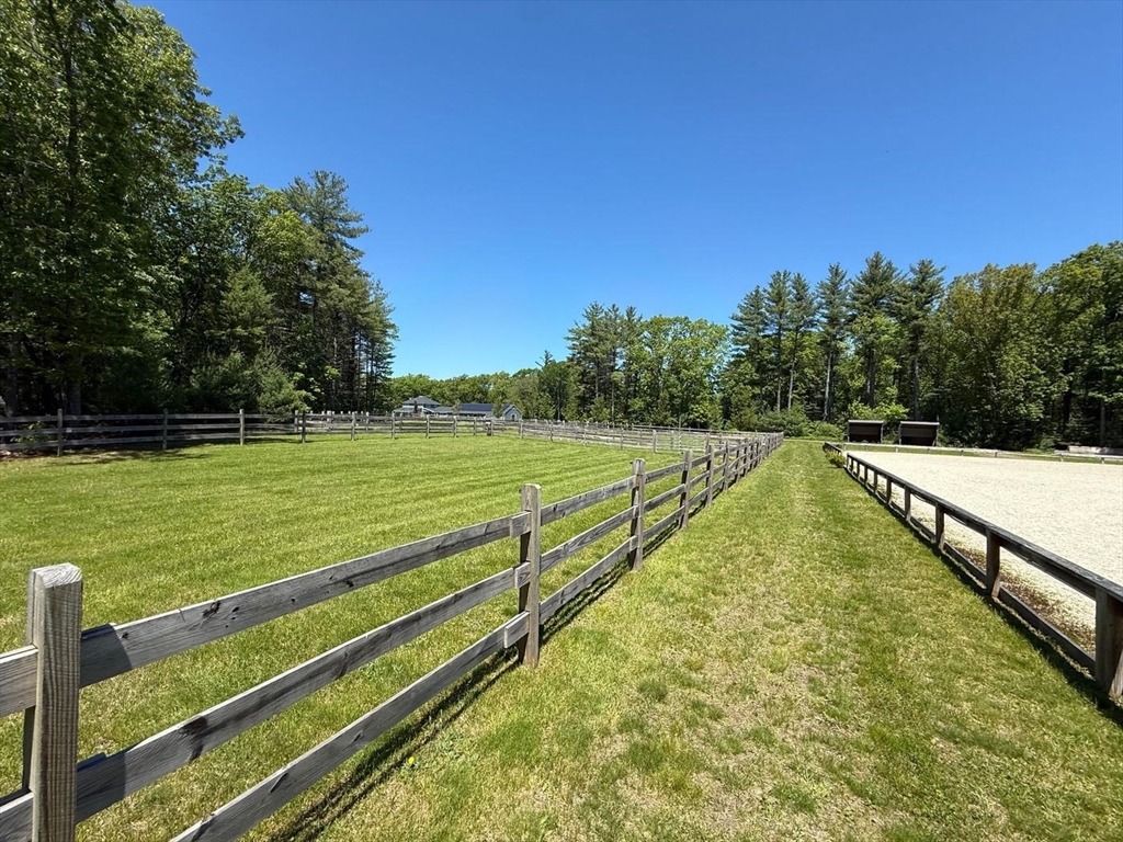 28 Deer Run Road Boxford, MA 01921 - Photo 4 of 12 a view of a swimming pool with an outdoor seating