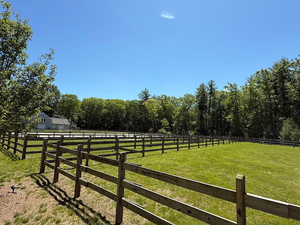 28 Deer Run Road Boxford, MA 01921 - Photo 7 of 12 a view of a tennis ground with large trees