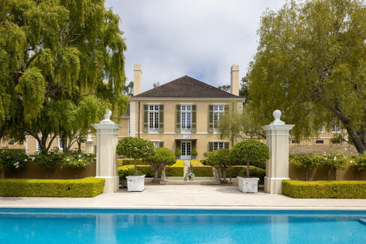 a front view of a house with yard porch and furniture