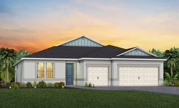 a front view of a house with a garden and yard