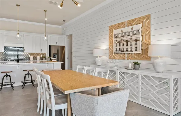 a living room with furniture and a mirror