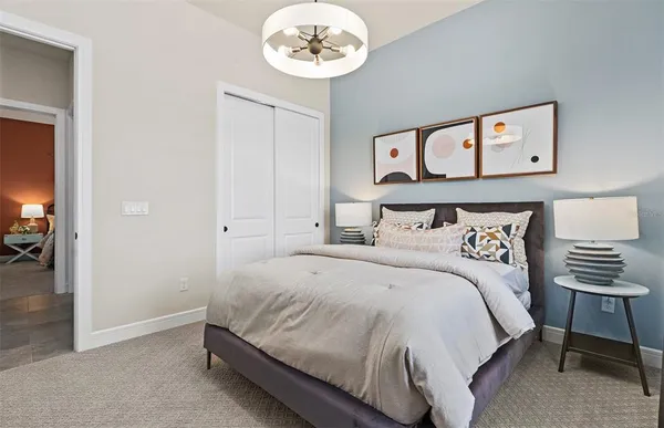 a bedroom with a bed and a dresser