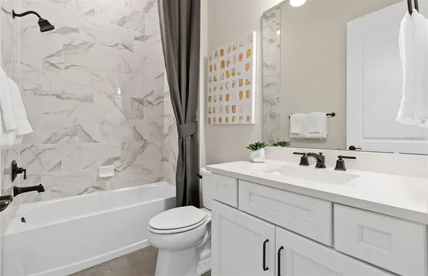 a bathroom with a toilet and a sink