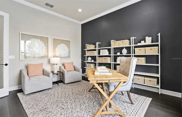 a living room with furniture and a table