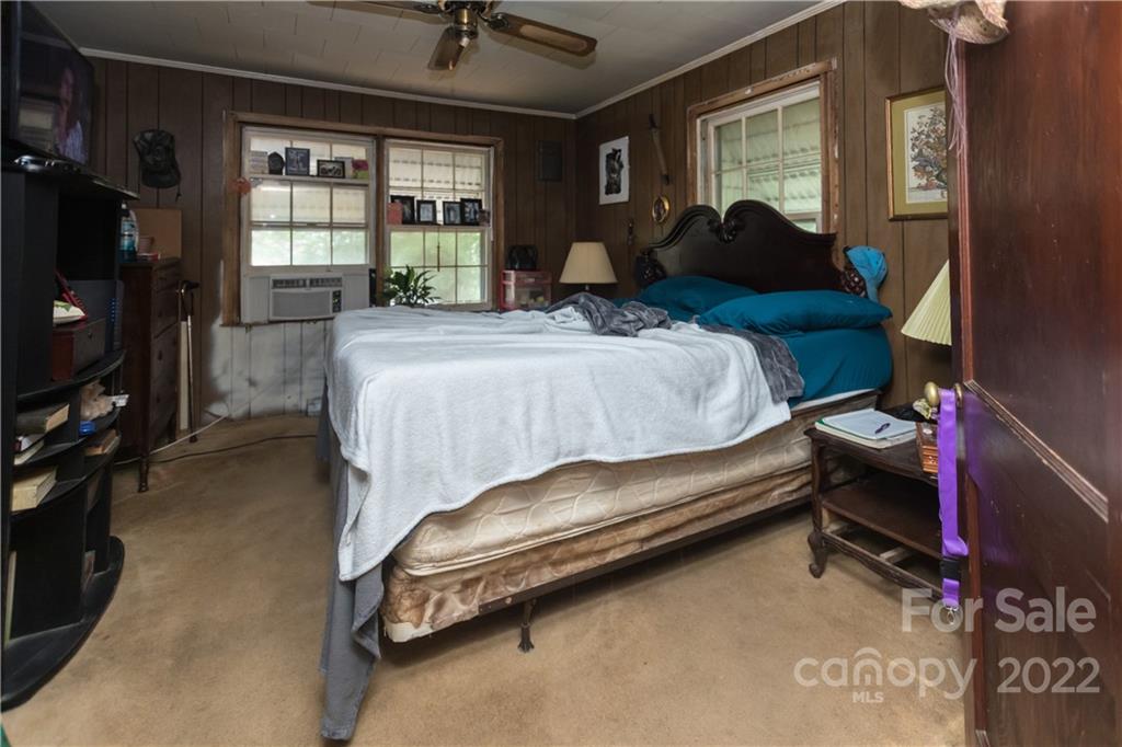 14925 North Old Statesville Road Huntersville, NC 28078 - Photo 12 of 18 a bed sitting in a bedroom next to a window