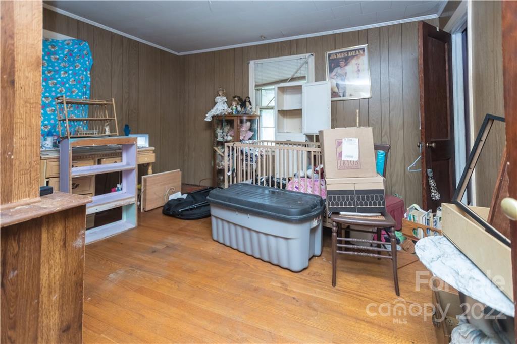14925 North Old Statesville Road Huntersville, NC 28078 - Photo 14 of 18 a bedroom with furniture and a book shelf