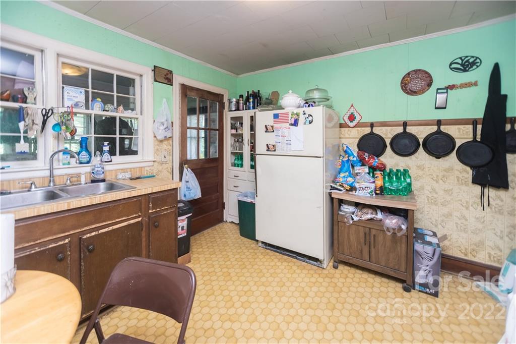 14925 North Old Statesville Road Huntersville, NC 28078 - Photo 18 of 18 a kitchen with a refrigerator and a stove top oven