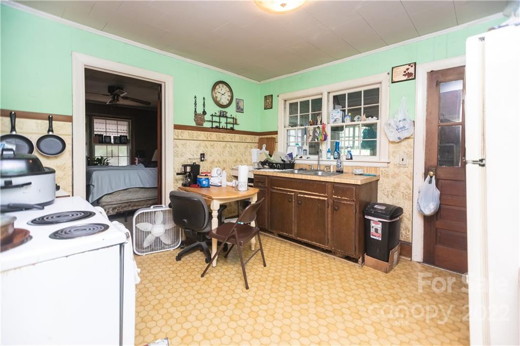 14925 North Old Statesville Road Huntersville, NC 28078 - Photo 9 of 18 a room with a stove a workspace and a window