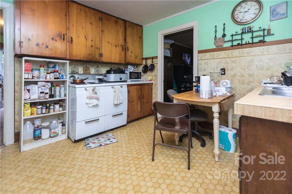 14925 North Old Statesville Road Huntersville, NC 28078 - Photo 10 of 18 a room with cabinets a clock and a book shelf