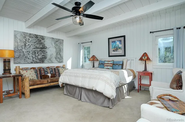 a bed room with a bed and a couch