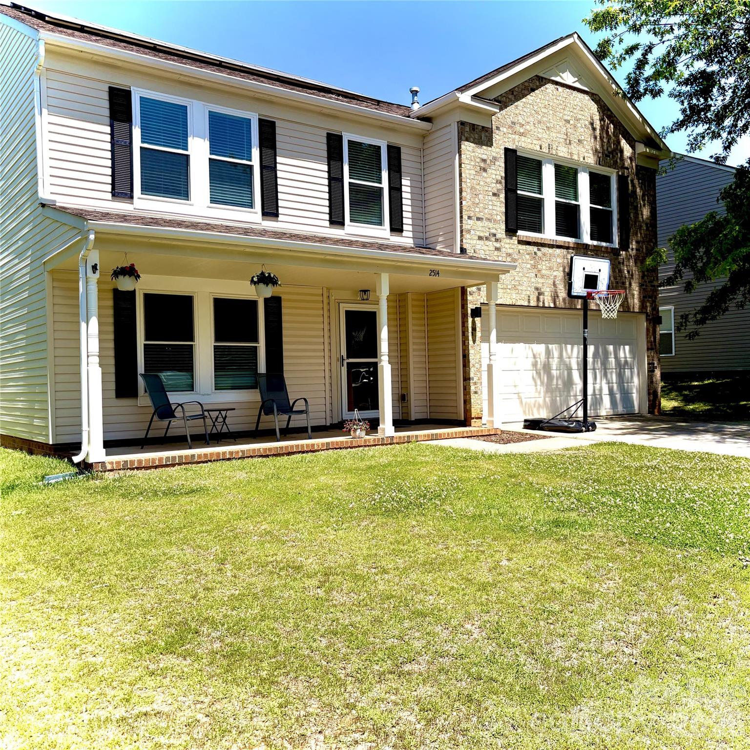 2514 Spring Breeze Way Monroe, NC 28110 - Photo 3 of 25 a front view of a house with a yard