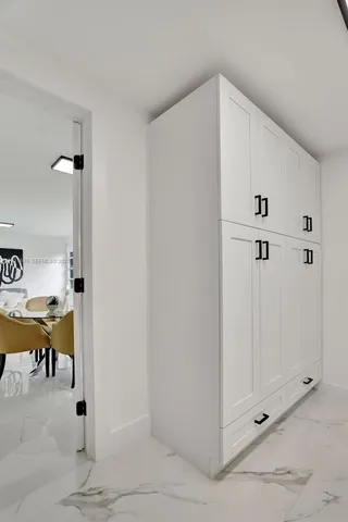 a view of a hallway with closet