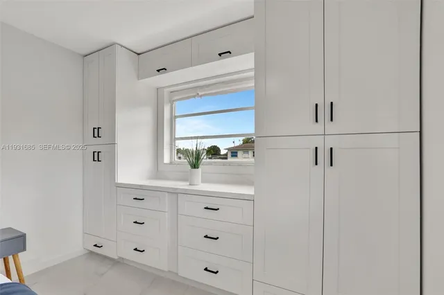 a bathroom with a shower sink and mirror