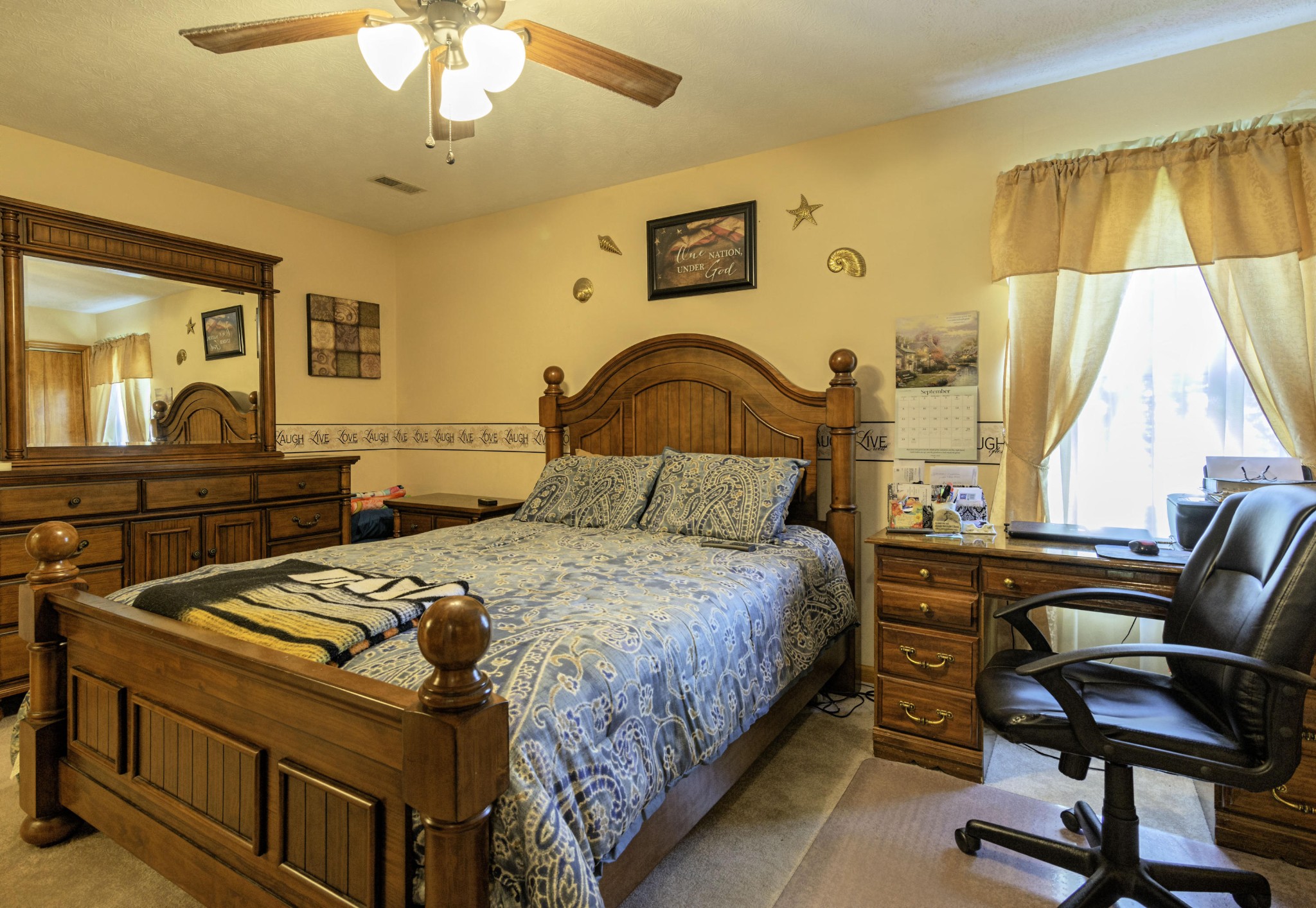 282 Little Tater Valley Road Luttrell, TN 37779 - Photo 15 of 26 a bedroom with a bed and a desk