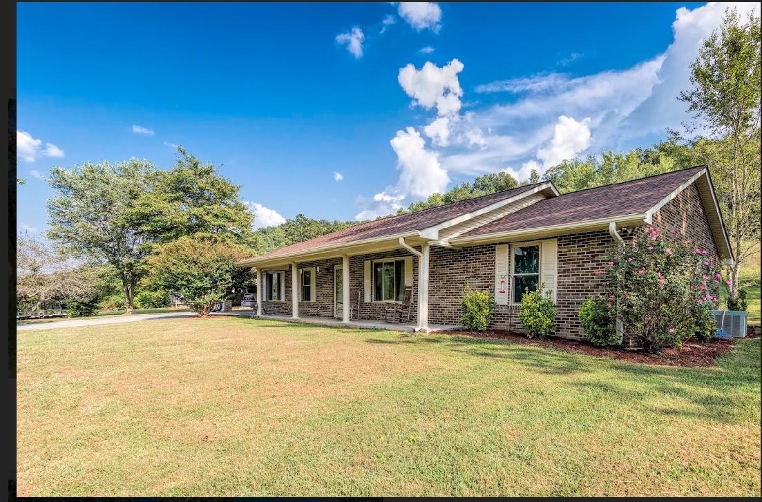 282 Little Tater Valley Road Luttrell, TN 37779 - Photo 3 of 26 a house view with a garden space