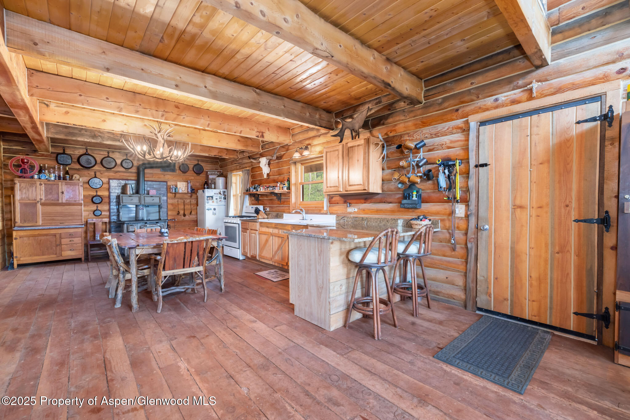 943 Routt Forest Drive Craig, CO 81625 - Photo 12 of 120 a view of a chairs and table in a patio