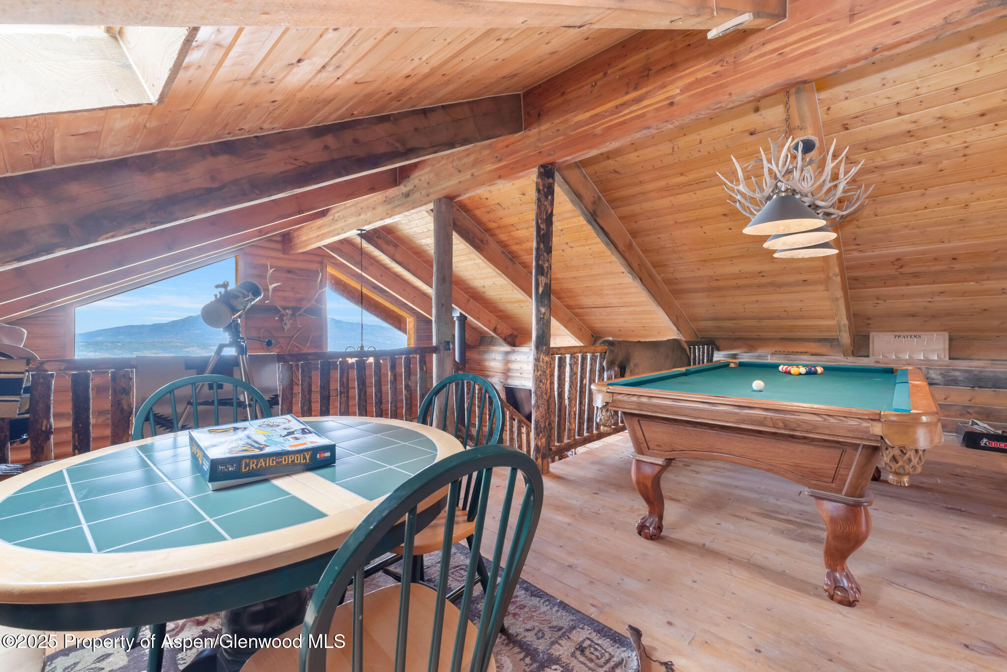 943 Routt Forest Drive Craig, CO 81625 - Photo 37 of 120 a dining room with furniture and wooden floor