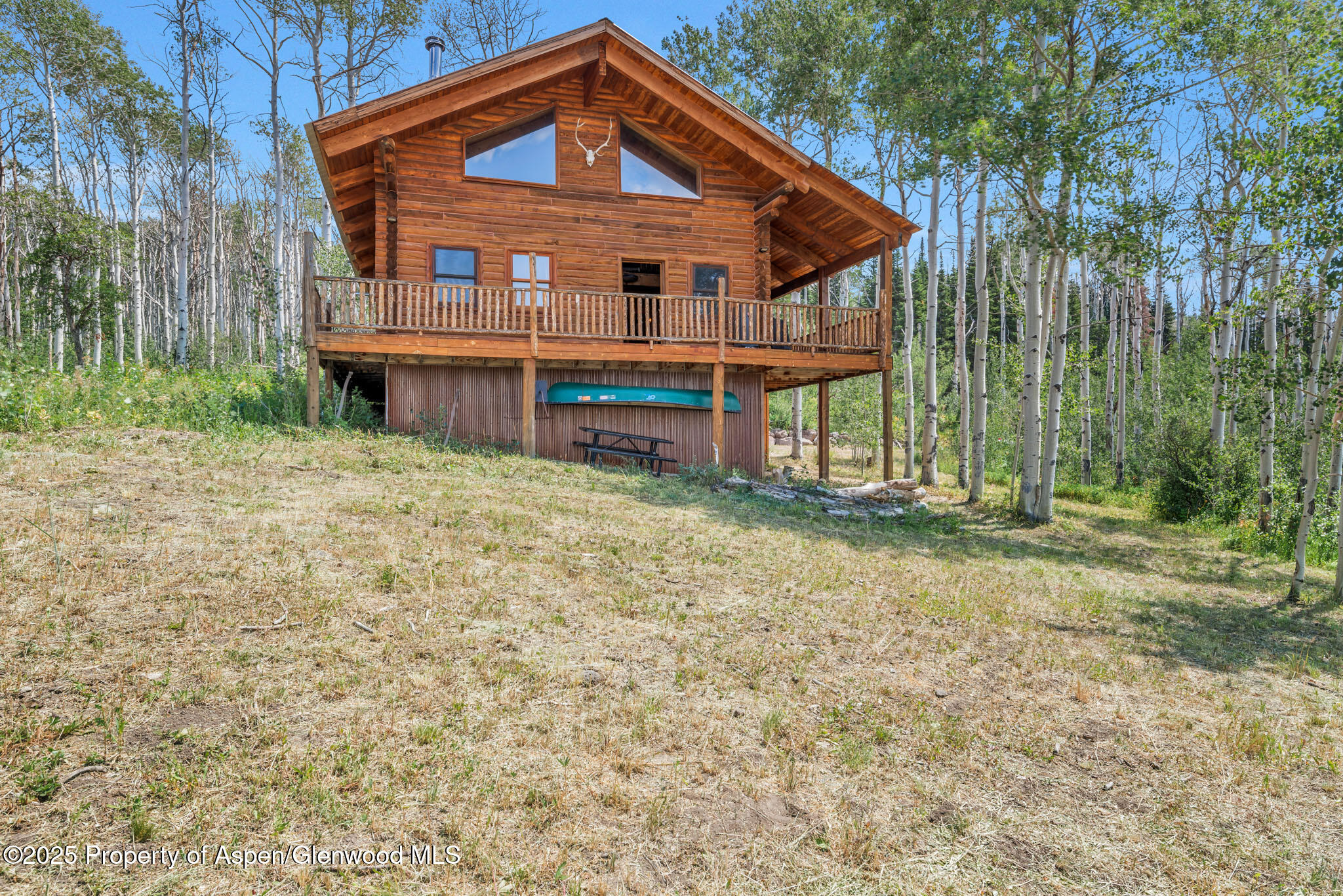 943 Routt Forest Drive Craig, CO 81625 - Photo 62 of 120 a front view of a house with a yard