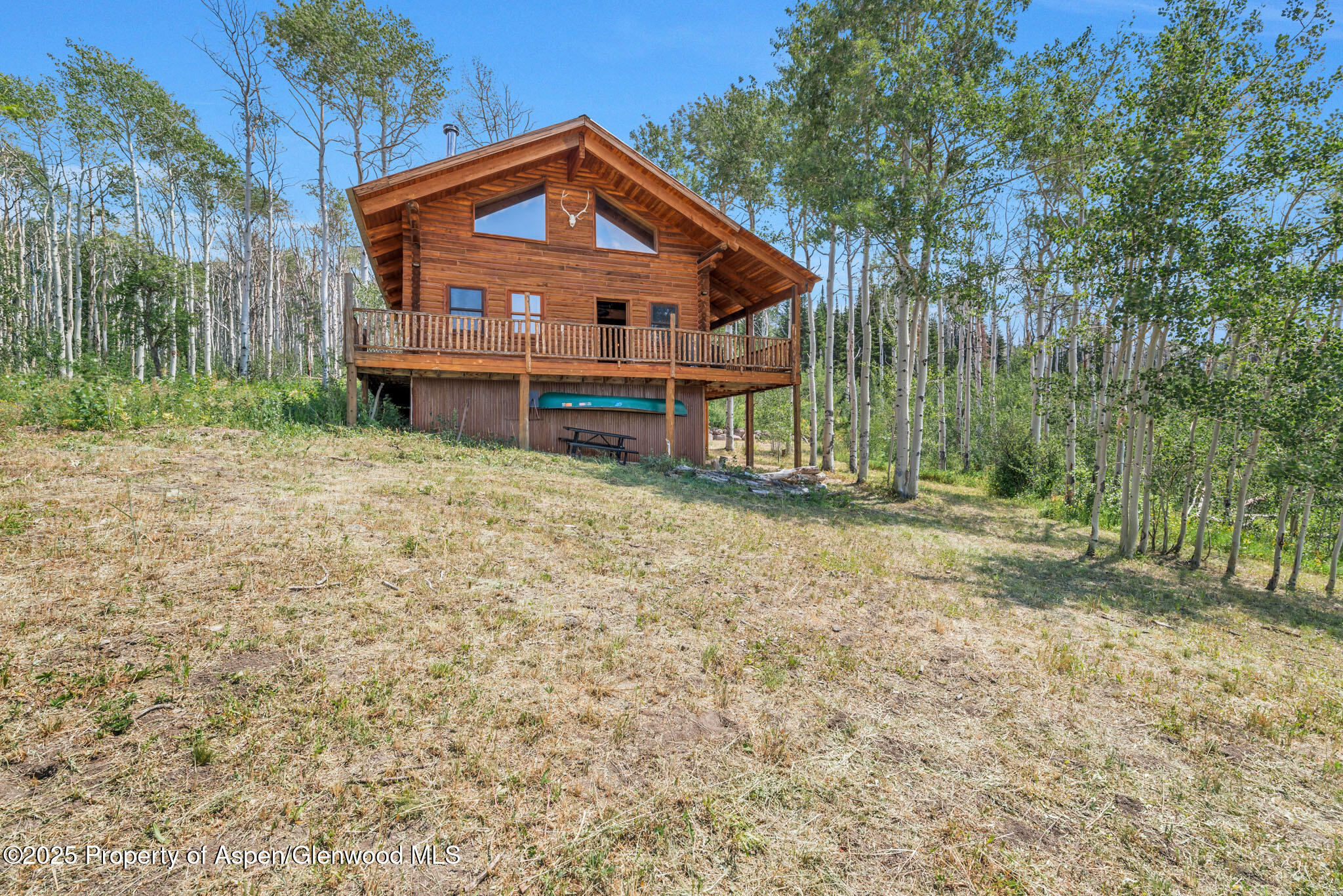 943 Routt Forest Drive Craig, CO 81625 - Photo 63 of 120 a front view of a house with a yard