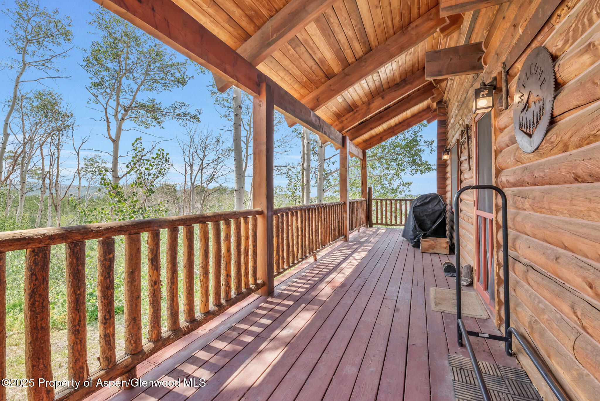943 Routt Forest Drive Craig, CO 81625 - Photo 65 of 120 a view of balcony with wooden floor and fence