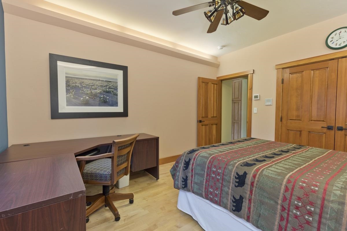 2500 Old Mammoth Road Mammoth Lakes, CA 93546 - Photo 33 of 48 a bedroom with a bed and a chandelier