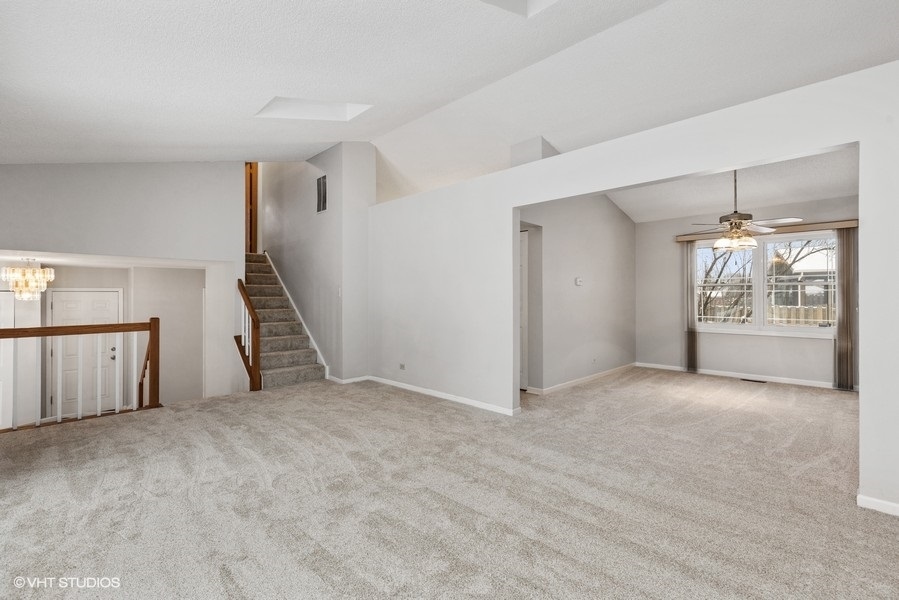 1310 Chatsworth Lane Hoffman Estates, IL 60169 - Photo 4 of 18 a view of an empty room with a fireplace