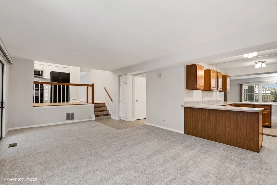 1310 Chatsworth Lane Hoffman Estates, IL 60169 - Photo 9 of 18 a view of an empty room with window and bathroom