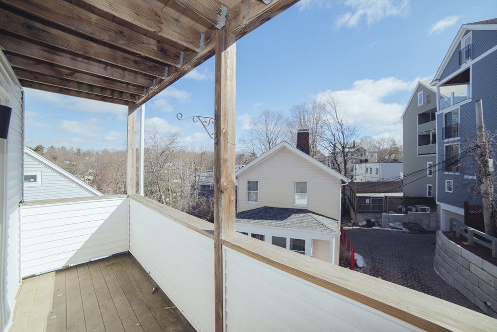 10 Duffley Court, Unit 1 Brookline, MA 02467 - Photo 21 of 23 a view of a balcony with a potted plant