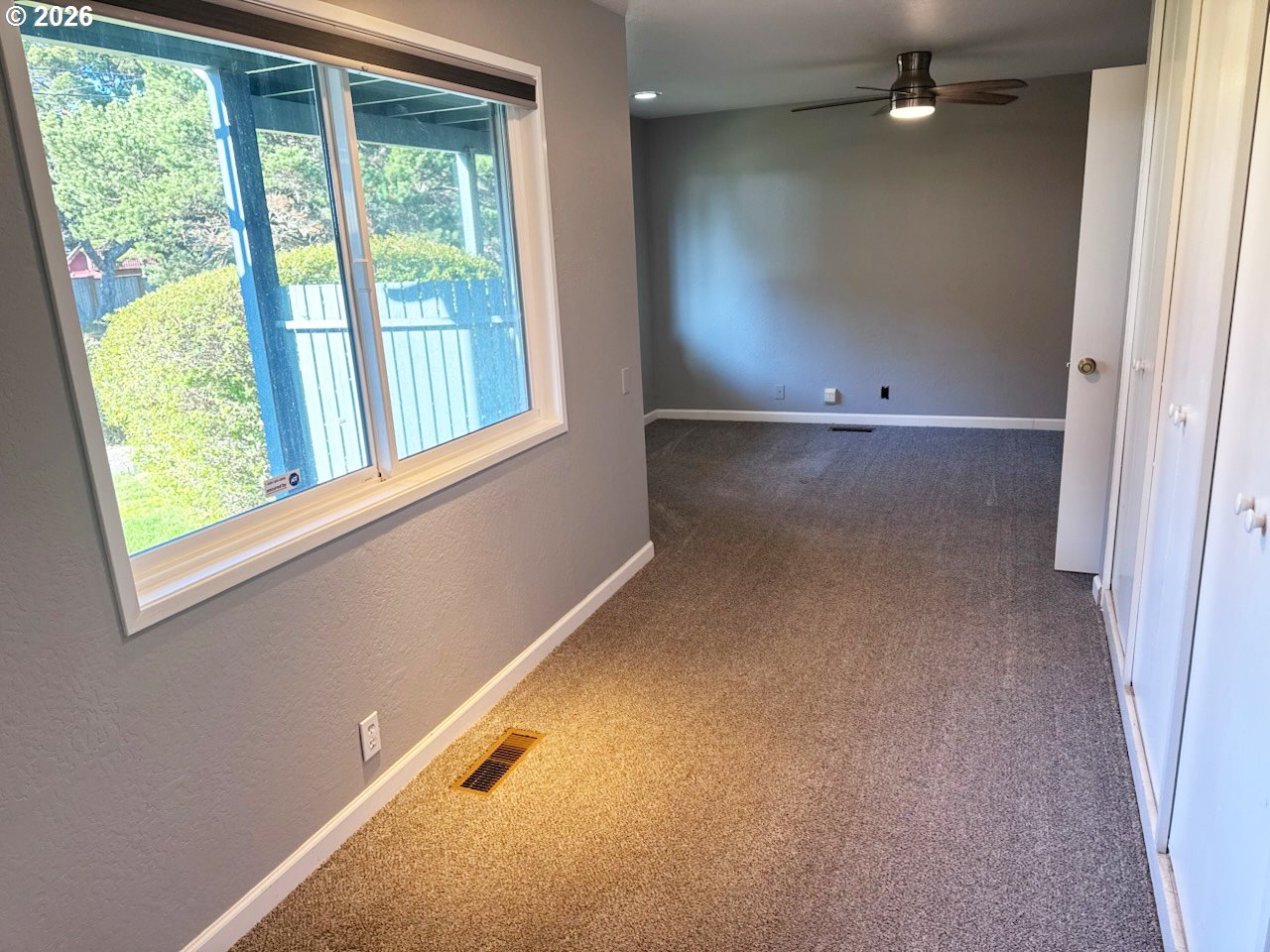 3085 Beach Loop Drive Southwest Bandon, OR 97411 - Photo 36 of 46 an empty room with a empty space and windows
